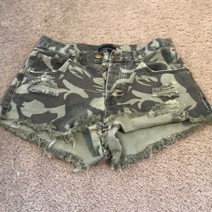 Distressed camo shorts